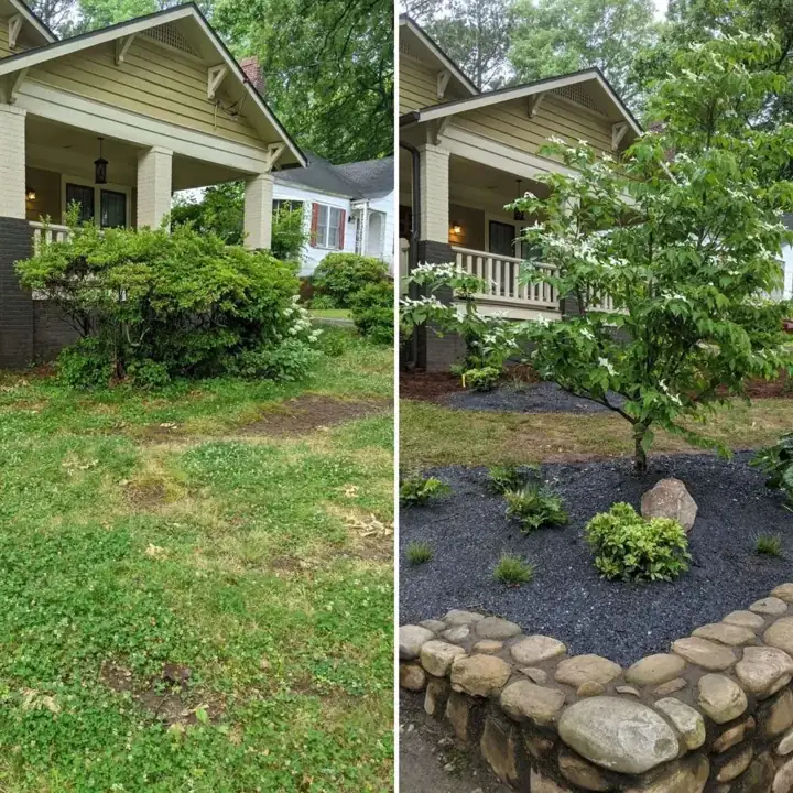 New planting bed along a stone wall in a front yard