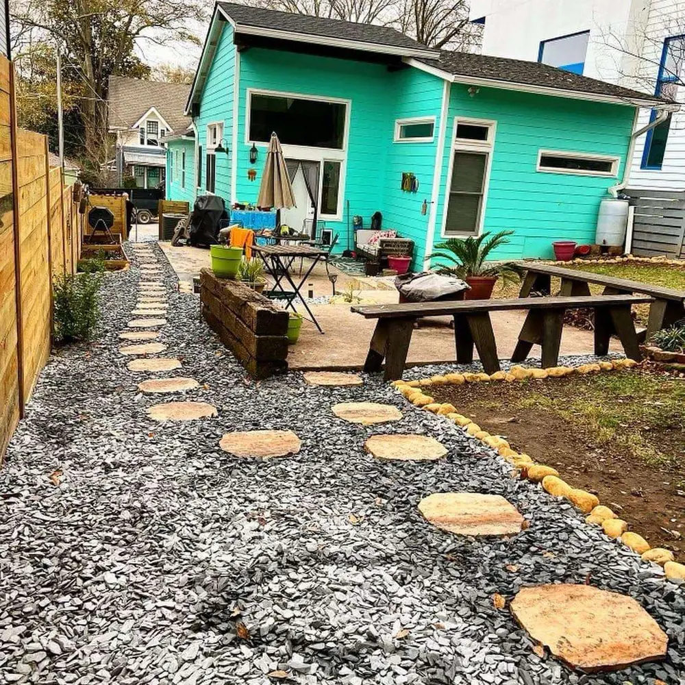 Backyard makeover with stepping stones and raised beds